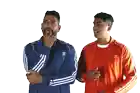 a man in a blue adidas jacket stands next to a man in an orange adidas jacket