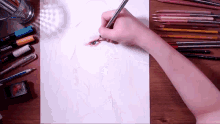 a person is drawing a picture of a person 's eye with a pencil