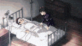a person is laying in a hospital bed with a nurse standing next to them .