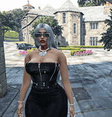 a woman in a black dress and sunglasses stands in front of a large house