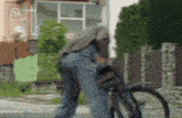 a blurred image of a man riding a bike with the word premier on the bottom