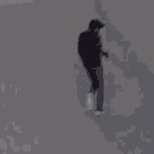 a person is running down a street in a blurry photo .