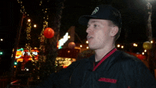 a man wearing a hat and a shirt that says ucsf