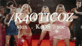 a group of women are dancing in front of a sign that says kaoticoz stox k4os soc