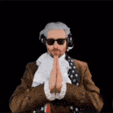 a man in a suit and tie is praying in front of a superhero