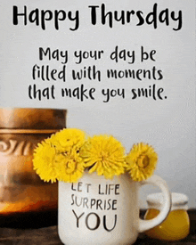 a happy thursday message with a cup of flowers