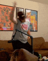a man is dancing in front of a microphone in front of a minecraft poster