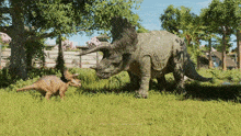 a triceratops and a baby triceratops are standing in the grass