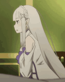 a girl with long white hair and purple sleeves is standing in a room .