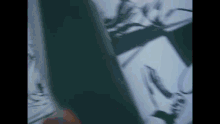 a blurry picture of a person 's face is being displayed on a screen .
