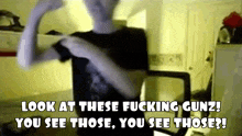 a man in a black shirt says look at these fucking gunz you see those you see those ?