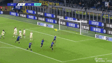 a soccer game is being played on a field with advertisements for 1xbet and milano