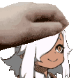 a close up of a person 's hand holding a cartoon character 's face .