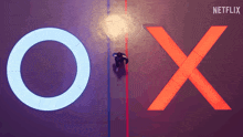 an aerial view of a person standing in front of a netflix logo