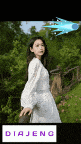 a picture of a woman in a white dress with the word diajeng on the bottom right