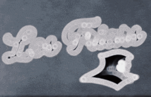 the word los angeles is written in white on a gray background