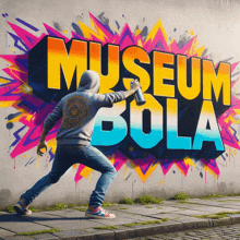 a man is spray painting the word museum bola on a wall