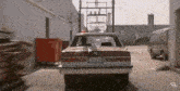 a red car with a license plate that says 759-411