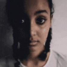 a woman with half of her face in the dark