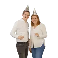 a man and a woman wearing party hats that say " happy new year "