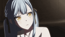 a girl with long blue hair and yellow eyes looks at the camera