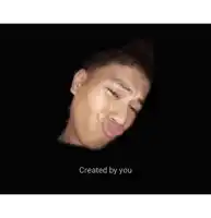 a young man with his tongue hanging out making a funny face