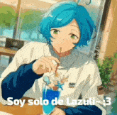 a boy with blue hair is sitting at a table drinking from a straw .