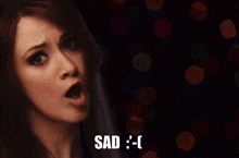 a woman with a surprised look on her face and the word sad below her