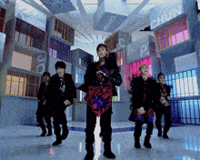 a group of young men are dancing in front of a building with chun written on it