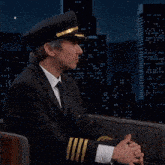 a man in a pilot 's hat is talking about people calling it that