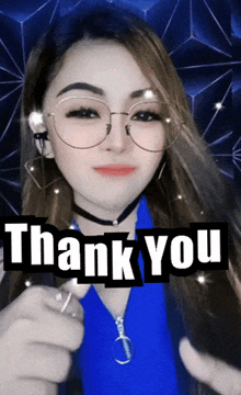 a woman wearing glasses is giving a thumbs up with the words thank you behind her