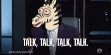 a man in a suit and tie with a zebra head on his face says talk talk talk talk
