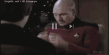a man in a star trek uniform is playing a video on fringelife set 1 589 246 ganger