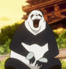a panda bear is sitting on the ground with its mouth open .