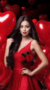a woman in a red dress is surrounded by red balloons