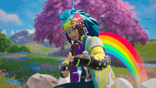 a girl with a rainbow in the background is holding a purple object