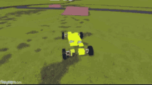 a yellow toy car is driving down a road in a game