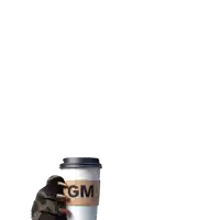 a gm coffee cup is being held by a hand