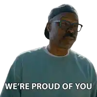 a man wearing glasses and a hat with the words we 're proud of you