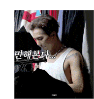 a man wearing a white tank top and a necklace has a tattoo on his arm that says " always "
