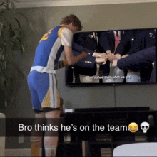 bro thinks he 's on the team in front of a television screen