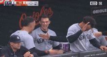 a group of new york yankees baseball players are hugging