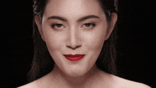 a close up of a woman with red lipstick on her lips