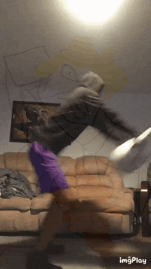 a gif of a person jumping on a couch with the words imgplay below