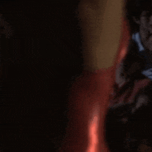 a blurry picture of a group of people sitting in a dark room