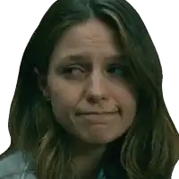 a close up of a woman 's face with a slight smile on her face