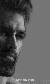 a black and white photo of a man with a beard and the words `` hop on cod '' .