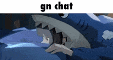 a person wearing a shark costume is laying in bed .