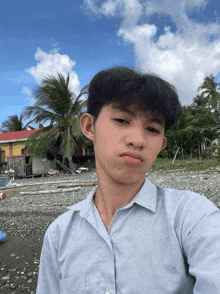 a young man taking a selfie in front of a building