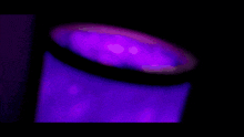 a purple background with a smiley face in the middle of it